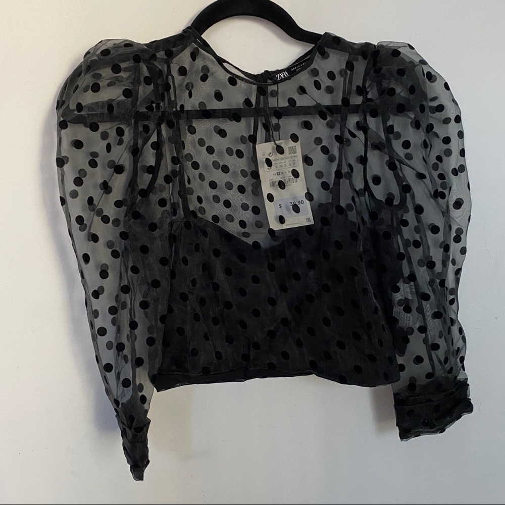Puff sleeve polka dot top.